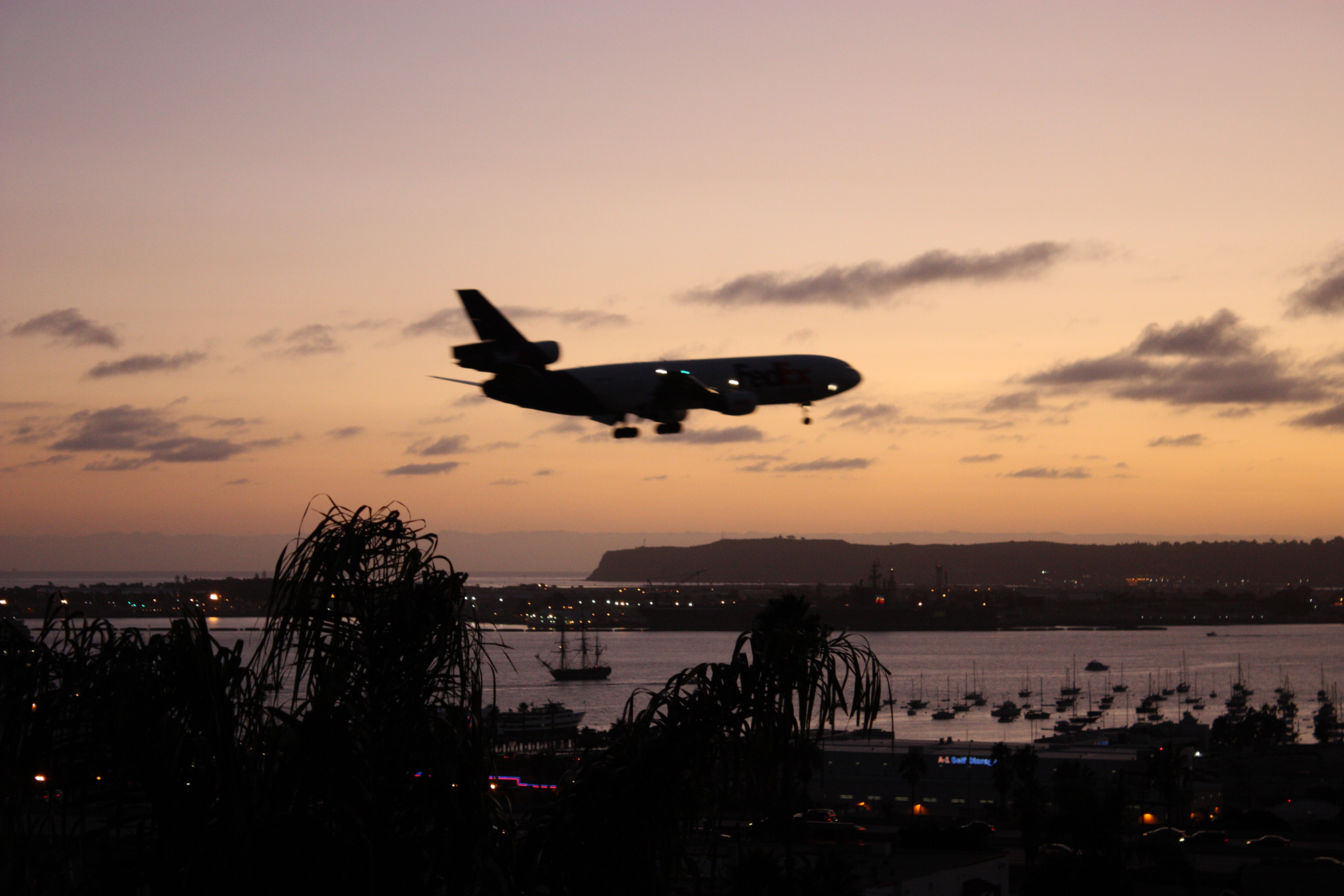 HMS_Surprise_at_sunset_with_airplane