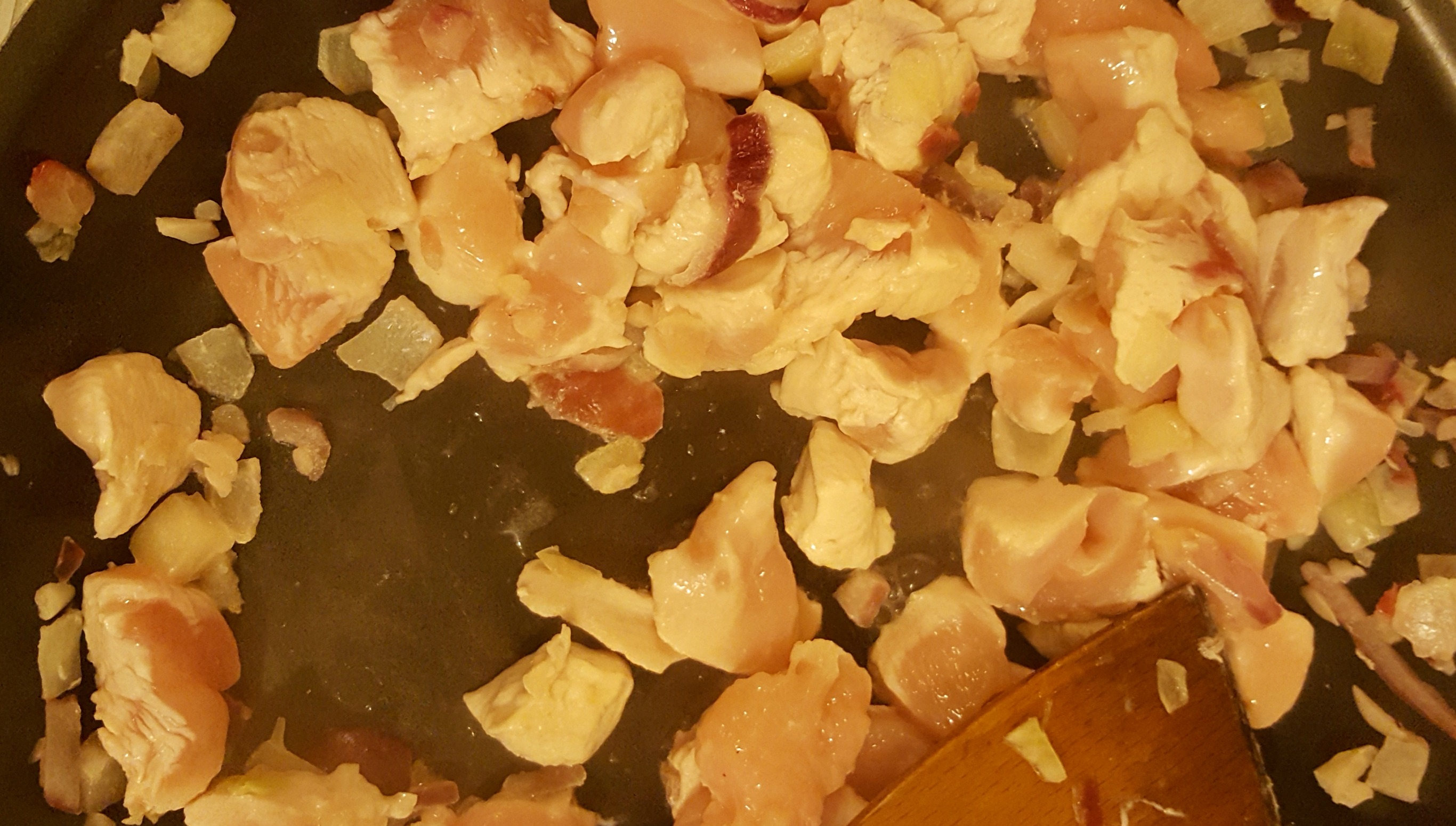 Adding the chicken to the mixture
